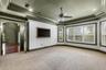 The sellers have opted to leave the framed wall mounted TV that provides a touch of elegance that the standard big screen can't come close to duplicat