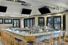 And the U-Shaped Bar features a view and sports on TV at the same time.