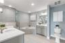 Primary bathroom with dual vanities