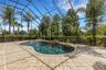 Completely screen enclosed by a 2-story structure.