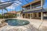 Travertine decking all around.