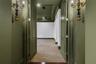 The primary suite is on the first floor and secluded away through double doors.