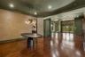 Custom grass cloth covers the wall in many of the formal spaces.