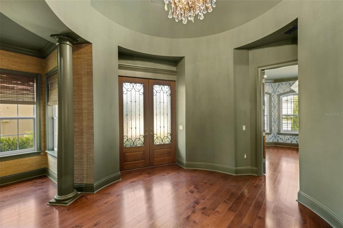 From the moment you step inside through the custom wood double doors to the signature rotunda foyer . . .