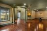 With gleaming wood flooring throughout, 12' ceilings and dramatic "one of a kind" architectural elements.