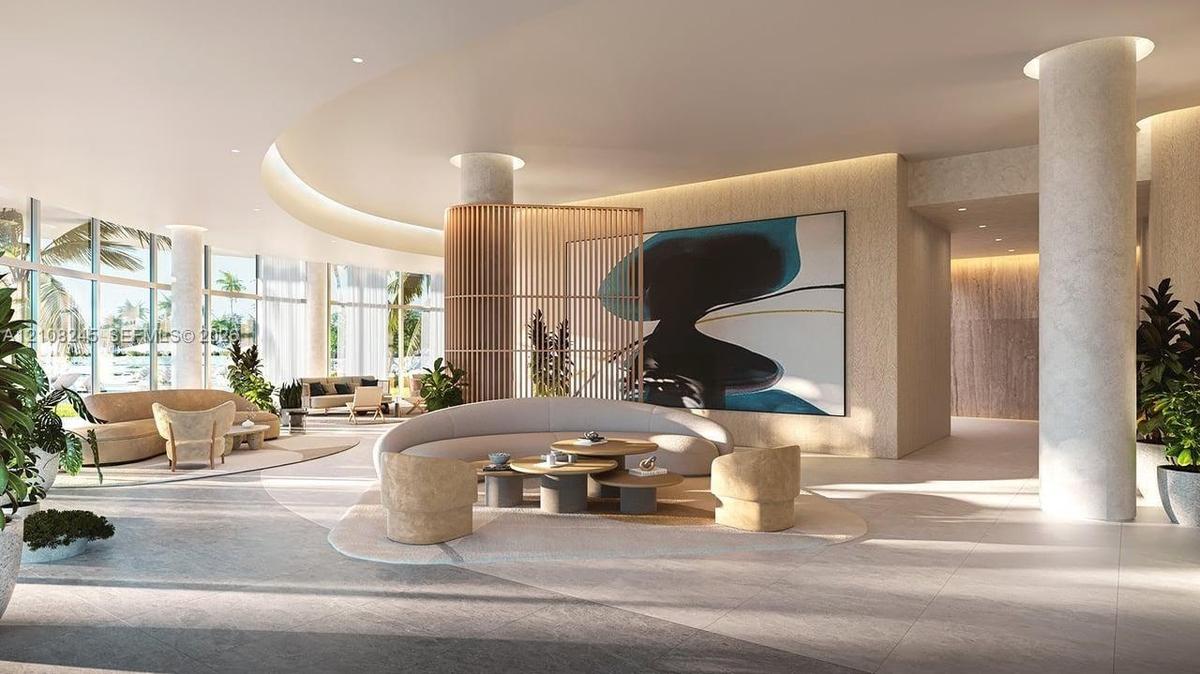 Expansive lobby featuring a curved architectural ceiling, floor-to-ceiling windows, structural columns, built-in vertical slat partition, and tile flo