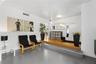 Multi-level flooring featuring large-format grey tile and raised wood-finish platform