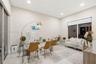 Neutral-toned room featuring large-format tile flooring, recessed ceiling lighting, and sliding glass doors with integrated roller shades
