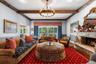 Cozy Family room adjacent to the kitchen, recreation room and outdoor entertainment area.