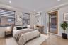 Wood-finish flooring, recessed lighting, dual-pane windows with integrated blinds, wall-mounted ductless climate control system, and a sliding glass d