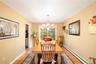 Dining area featuring wood flooring,  and wide archway to living room