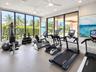 Fitness center featuring floor-to-ceiling windows, recessed lighting, ceiling fans, and durable flooring