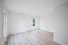 Bright interior space featuring vinyl wood-finish flooring, recessed lighting, and double-pane windows