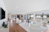 Open-concept interior featuring wood-finish flooring, recessed lighting, and large sliding glass doors