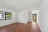 Interior space featuring wood-finish flooring, recessed lighting, and a glass-paneled exterior door with black framing