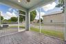 Screened-in patio featuring paver flooring, recessed ceiling lighting, a ceiling fan, and metal fencing