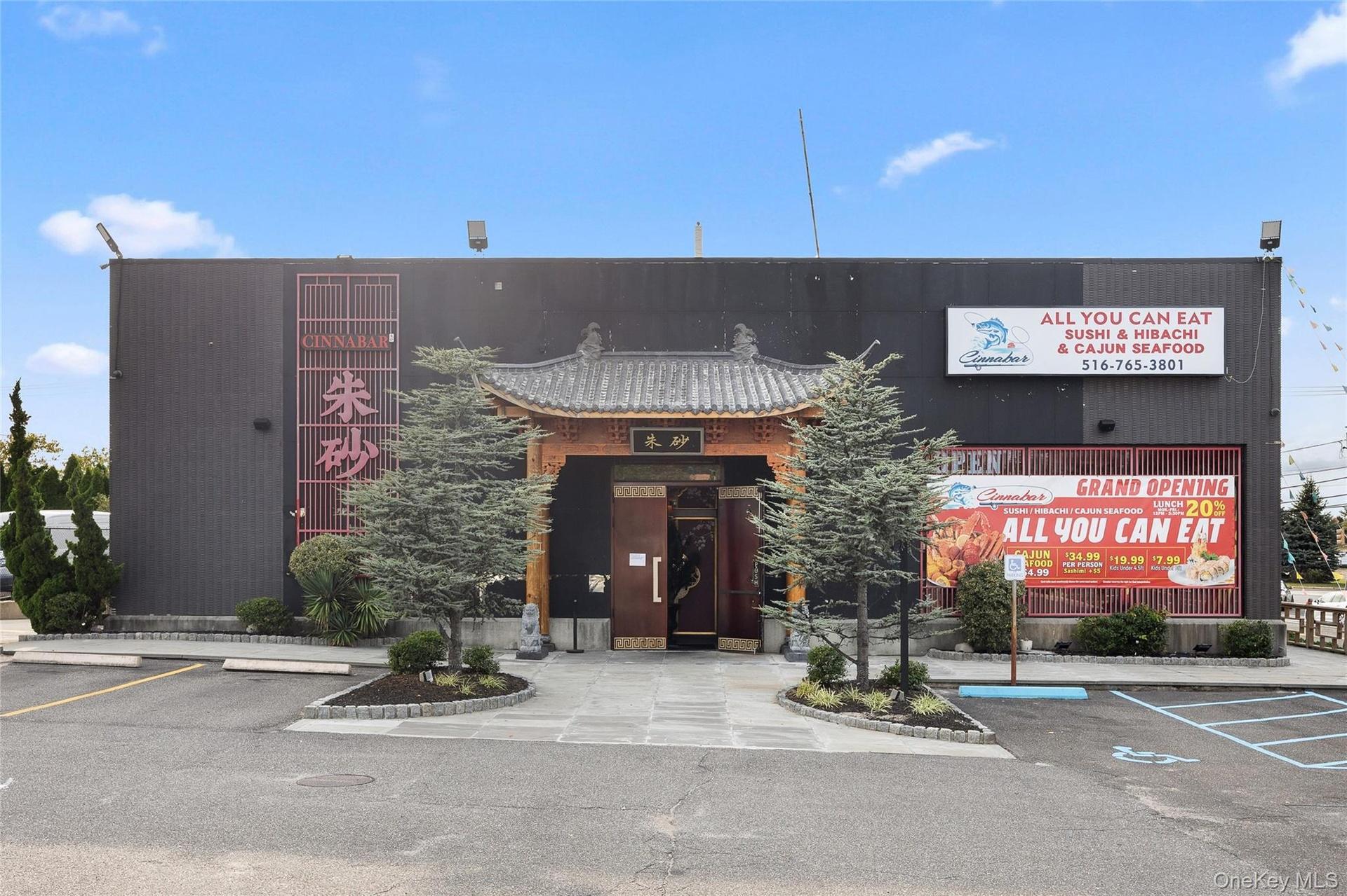 View of commercial location with uncovered parking