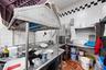 Kitchen featuring tile walls, light tile patterned flooring, decorative backsplash, and island range hood