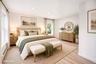 Light-filled room featuring vinyl wood-finish flooring, recessed lighting, and multiple windows *virtually staged