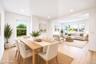 Open-concept living space featuring vinyl wood-finish flooring, recessed lighting, and multiple windows *virtually staged