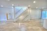 Staircase featuring white vertical spindles, natural wood-finish treads, and recessed lighting throughout