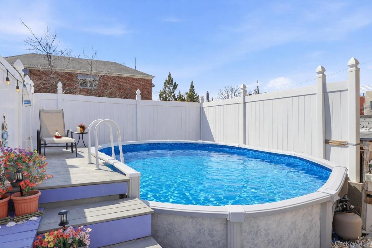 deck off Kitchen with above ground pool