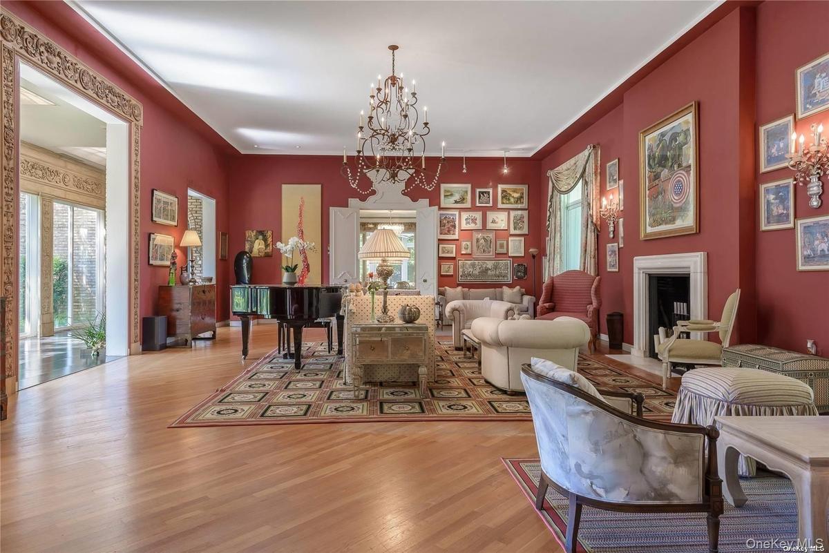 Grand Living Room with High Ceiling, Fireplace and Wood Floor
