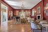 Grand Living Room with High Ceiling, Fireplace and Wood Floor