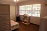 Wood-finish flooring, multi-pane window with integrated blinds, and ceiling fan with integrated lighting fixture