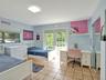 Ceramic tile flooring, glass-paneled double doors, mirrored closet doors, and a flush-mount overhead light fixture