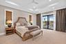 Owners Suite: Motorized Window Treatment.  Sliders lead to the lanai
