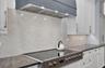 7-burner, 48" Fulgor Milano induction range and custom wood hood