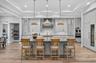 Dovetail Wood Cabinetry with Display Shelving.  Designer pendants.