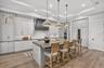 Custom Tile Backsplash, Walk-in Pantry with electric outlets.