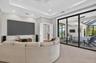 140" screen, short throw projector, two in-wall subs, immersive theater quality audio