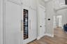 Sub Zero Freezer (left) Wine Fridge (center) Refrigerator (right)