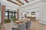 Wood Beams, Designer Lighting and Custom PGT French Doors