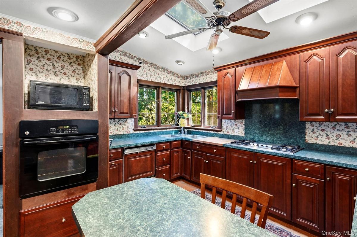 Eat in Kitchen with a water view and skylights