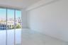 Floor-to-ceiling windows, large-format polished tile flooring, and urban skyline backdrop