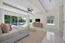Tray ceiling featuring recessed LED accent lighting, floor-to-ceiling sliding glass doors, polished flooring, a black multi-blade ceiling fan, and rec