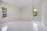 Neutral interior featuring glossy tile flooring, recessed lighting, and dual windows