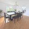 Wood-finish flooring, crown molding, a modern multi-tier chandelier, and a large window featuring outdoor scenery