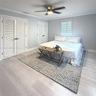 Light-toned wood-finish flooring, double louvered closet doors, single louvered closet door, crown molding, and a central ceiling fan with an integrat