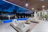 Covered outdoor living area featuring a wood-plank ceiling, recessed lighting, tile flooring, stone-veneer accent wall, and a rectangular swimming poo