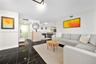 Polished black stone-finish flooring with white veining, recessed lighting, and kitchen island with pendant fixtures