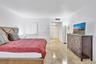 Polished stone flooring throughout and multi-panel interior doors