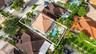 Aerial perspective featuring a tile roof, an in-ground swimming pool, and a hardscaped patio with concrete pavers