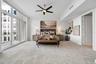 Oversized primary ensuite bedroom with private covered balcony