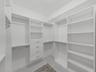 large closet with custom organizing