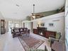 view front door: living and dining rooms, view of covered patio and screened-in pool
